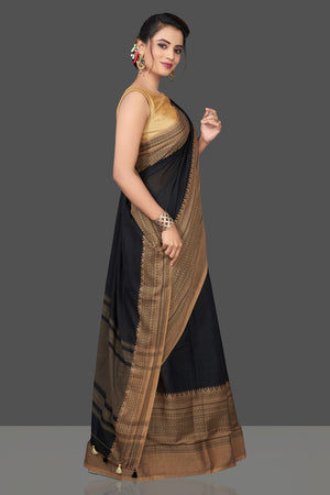 Shop gorgeous black cotton sari online in USA with beige weave border. Flaunt Indian fashion in USA with a stunning collection of handwoven sarees, cotton saris, pure silk sarees, printed saris in USA from Pure Elegance Indian saree store in USA.-side