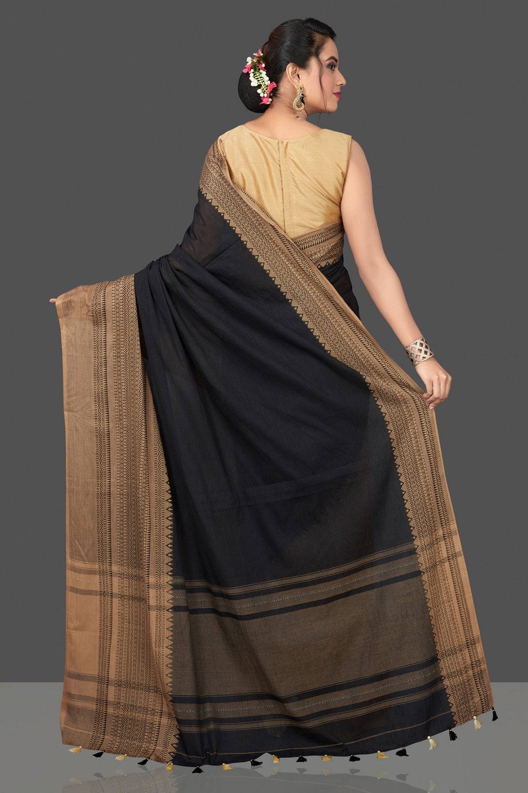 Shop gorgeous black cotton sari online in USA with beige weave border. Flaunt Indian fashion in USA with a stunning collection of handwoven sarees, cotton saris, pure silk sarees, printed saris in USA from Pure Elegance Indian saree store in USA.-back