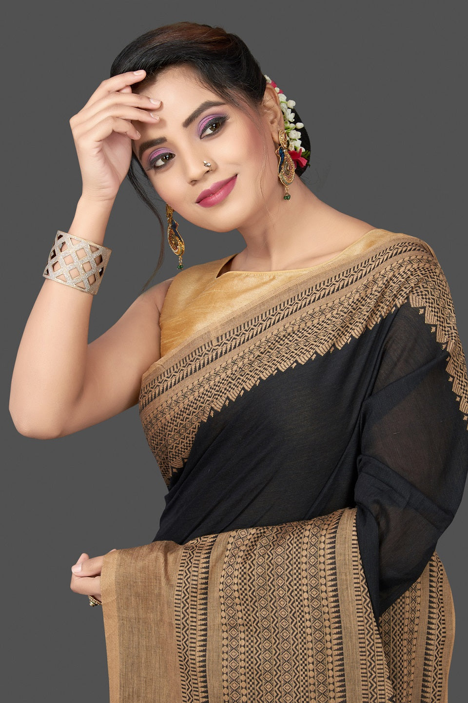 Shop gorgeous black cotton sari online in USA with beige weave border. Flaunt Indian fashion in USA with a stunning collection of handwoven sarees, cotton saris, pure silk sarees, printed saris in USA from Pure Elegance Indian saree store in USA.-closeup