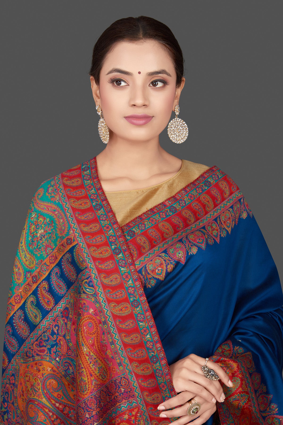 Shop beautiful indigo blue silk saree online in USA with red Kani embroidery border. Get ready for festive occasions and weddings in tasteful designer sarees, Banarasi sarees, handwoven sarees from Pure Elegance Indian clothing store in USA.-closeup