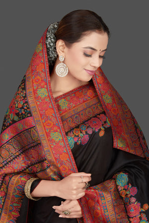 Buy stunning black tussar muga silk saree online in USA with Kani embroidery border. Get ready for festive occasions and weddings in tasteful designer sarees, Banarasi sarees, handwoven sarees from Pure Elegance Indian clothing store in USA.-closeup