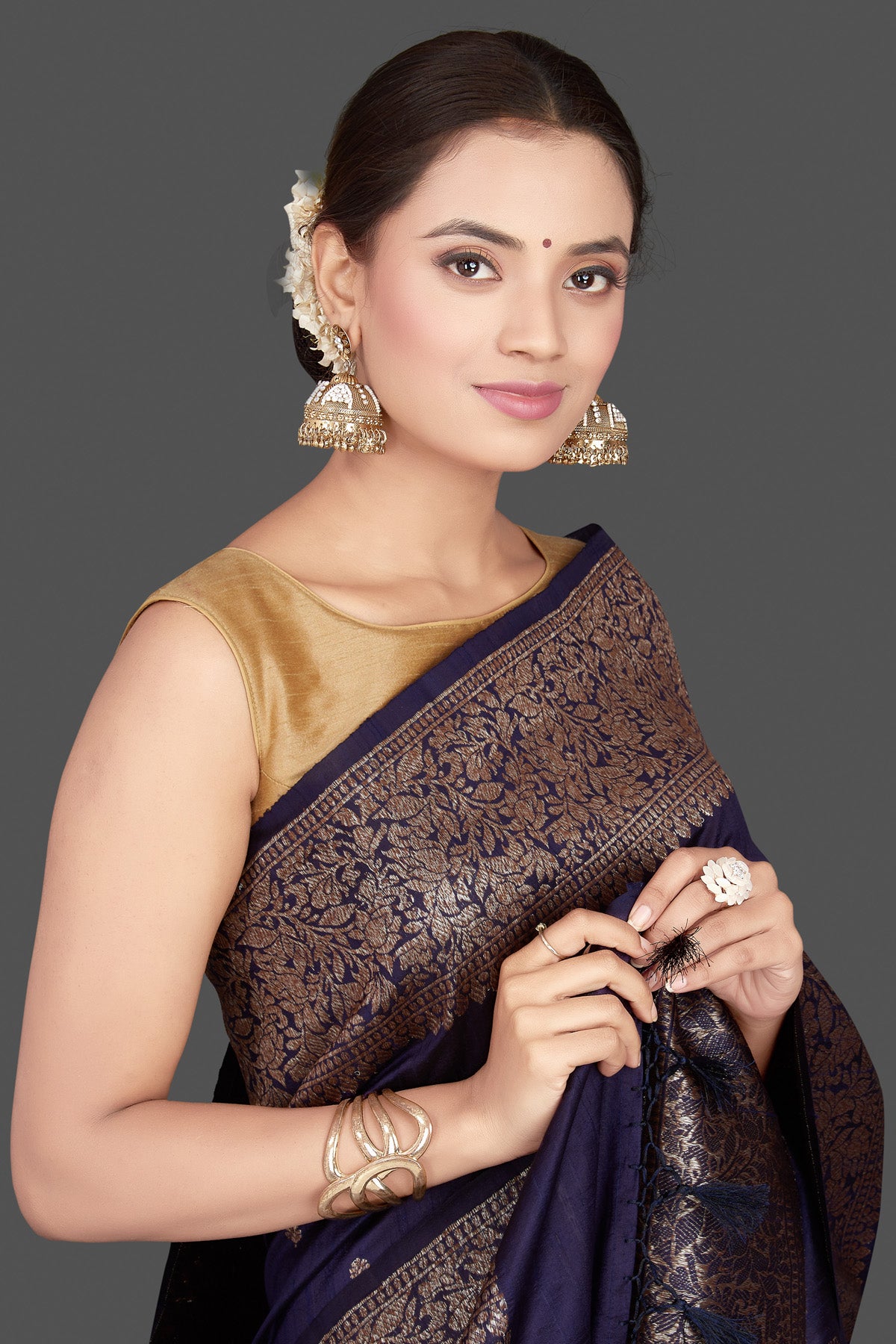 Buy beautiful navy tussar Banarasi saree online in USA with antique zari border. Go for stunning Indian designer sarees, georgette sarees, handwoven saris, embroidered sarees for festive occasions and weddings from Pure Elegance Indian clothing store in USA.-closeup