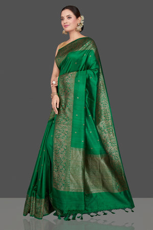 Buy gorgeous green tussar Banarasi sari online in USA with antique zari border. Go for stunning Indian designer sarees, georgette sarees, handwoven saris, embroidered sarees for festive occasions and weddings from Pure Elegance Indian clothing store in USA.-pallu