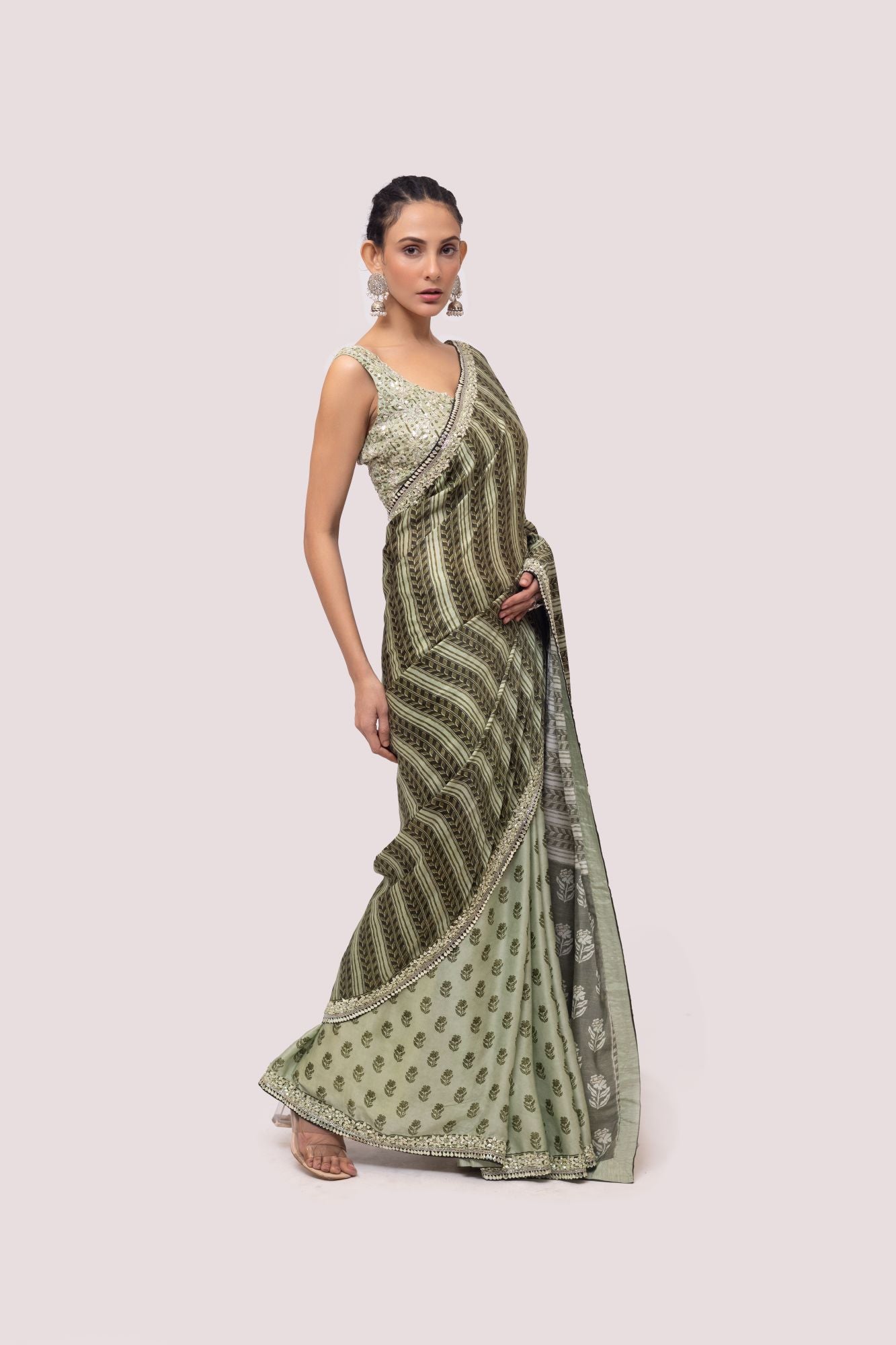 Shop beautiful olive green printed embroidered organza saree online in USA. Make a fashion statement on festive occasions and weddings with designer sarees, designer suits, Indian dresses, Anarkali suits, palazzo suits, designer gowns, sharara suits, embroidered sarees from Pure Elegance Indian fashion store in USA.-side
