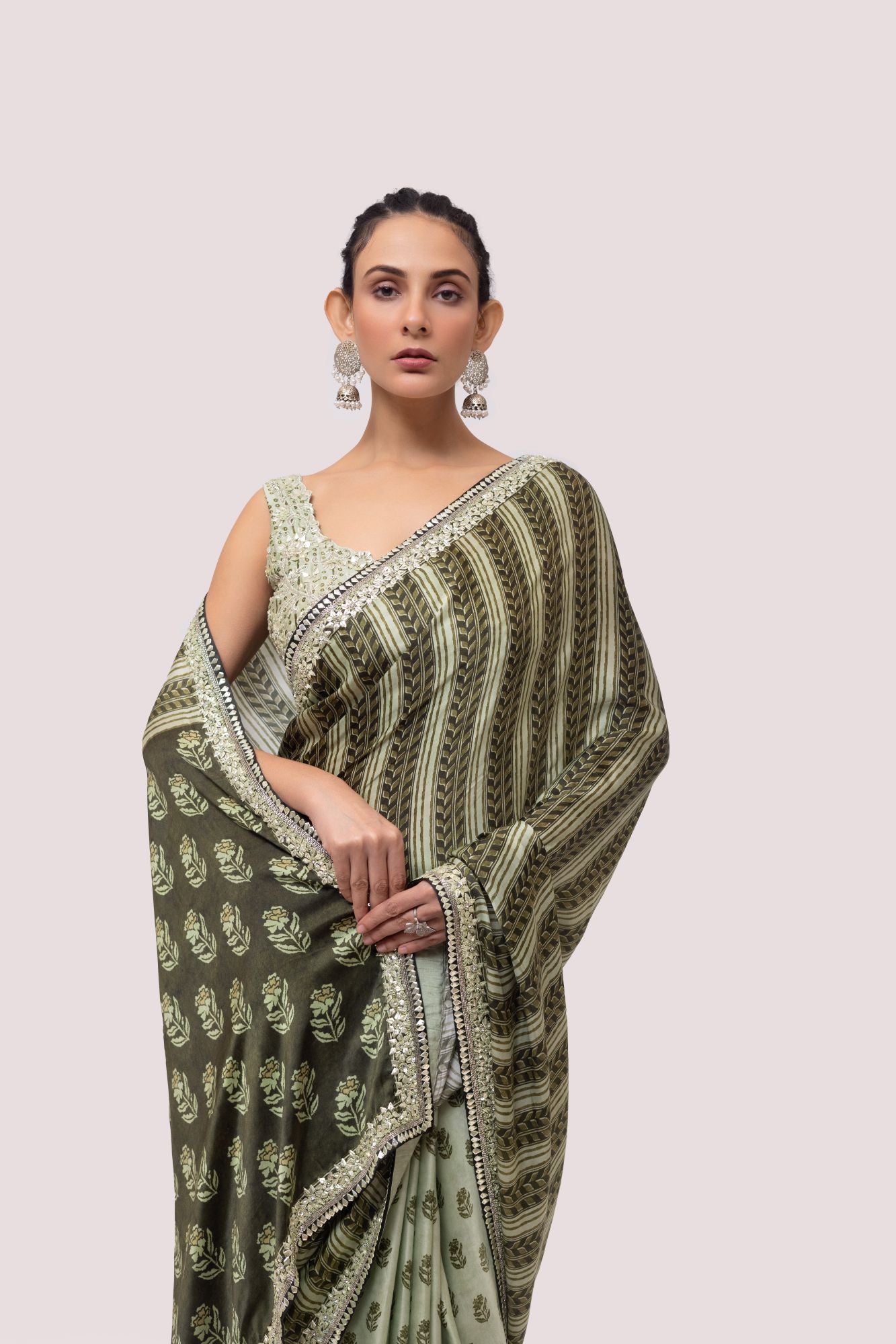 Shop beautiful olive green printed embroidered organza saree online in USA. Make a fashion statement on festive occasions and weddings with designer sarees, designer suits, Indian dresses, Anarkali suits, palazzo suits, designer gowns, sharara suits, embroidered sarees from Pure Elegance Indian fashion store in USA.-closeup