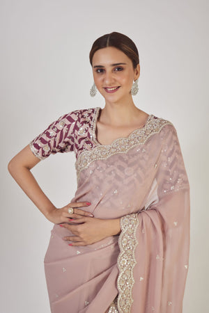 Buy beautiful dusty pink embroidered georgette saree online in USA with blouse. Make a fashion statement on festive occasions and weddings with designer sarees, designer suits, Indian dresses, Anarkali suits, palazzo suits, designer gowns, sharara suits, embroidered sarees from Pure Elegance Indian fashion store in USA.-closeup