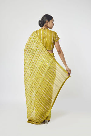 Buy beautiful mustard printed cutdana work georgette saree online in USA with blouse. Make a fashion statement on festive occasions and weddings with designer sarees, designer suits, Indian dresses, Anarkali suits, palazzo suits, designer gowns, sharara suits, embroidered sarees from Pure Elegance Indian fashion store in USA.-back