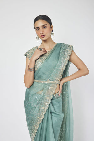 Buy fern green embroidered belted organza saree online in USA with saree blouse. Make a fashion statement on festive occasions and weddings with designer sarees, designer suits, Indian dresses, Anarkali suits, palazzo suits, designer gowns, sharara suits, embroidered sarees from Pure Elegance Indian fashion store in USA.-closeup
