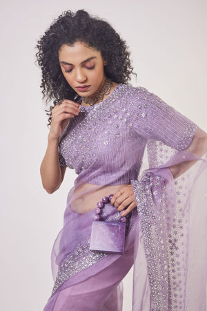 Buy beautiful lavender embroidered organza saree online in USA with saree blouse. Make a fashion statement on festive occasions and weddings with designer sarees, designer suits, Indian dresses, Anarkali suits, palazzo suits, designer gowns, sharara suits, embroidered sarees from Pure Elegance Indian fashion store in USA.-closeup