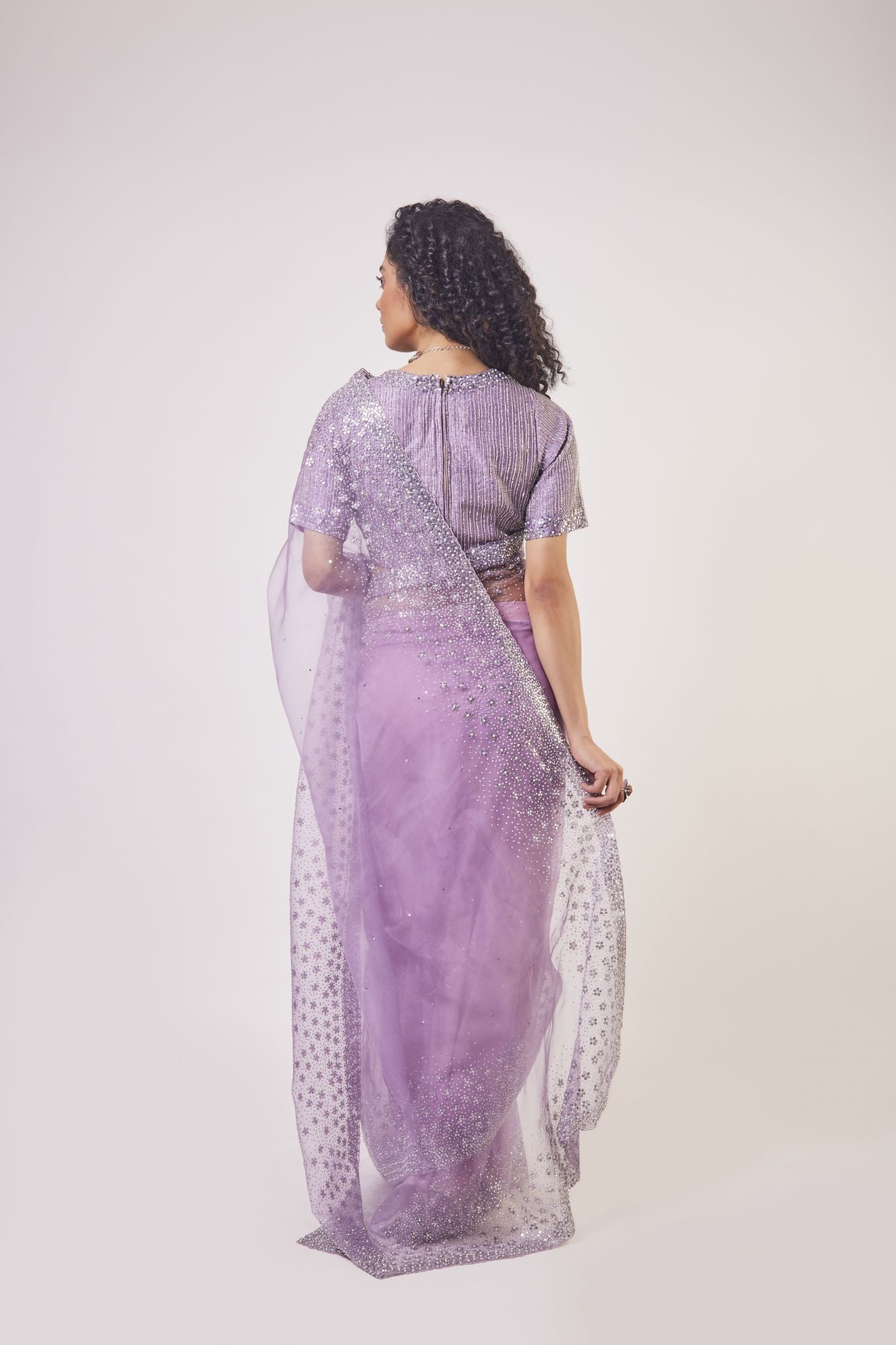 Buy beautiful lavender embroidered organza saree online in USA with saree blouse. Make a fashion statement on festive occasions and weddings with designer sarees, designer suits, Indian dresses, Anarkali suits, palazzo suits, designer gowns, sharara suits, embroidered sarees from Pure Elegance Indian fashion store in USA.-back
