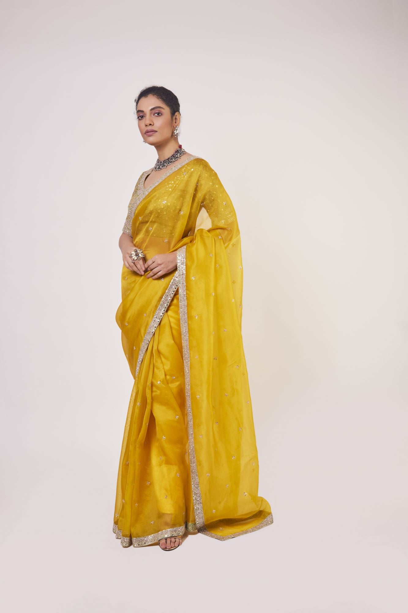 Buy stunning mustard embroidered organza saree online in USA with golden saree blouse. Make a fashion statement on festive occasions and weddings with designer sarees, designer suits, Indian dresses, Anarkali suits, palazzo suits, designer gowns, sharara suits, embroidered sarees from Pure Elegance Indian fashion store in USA.-pallu
