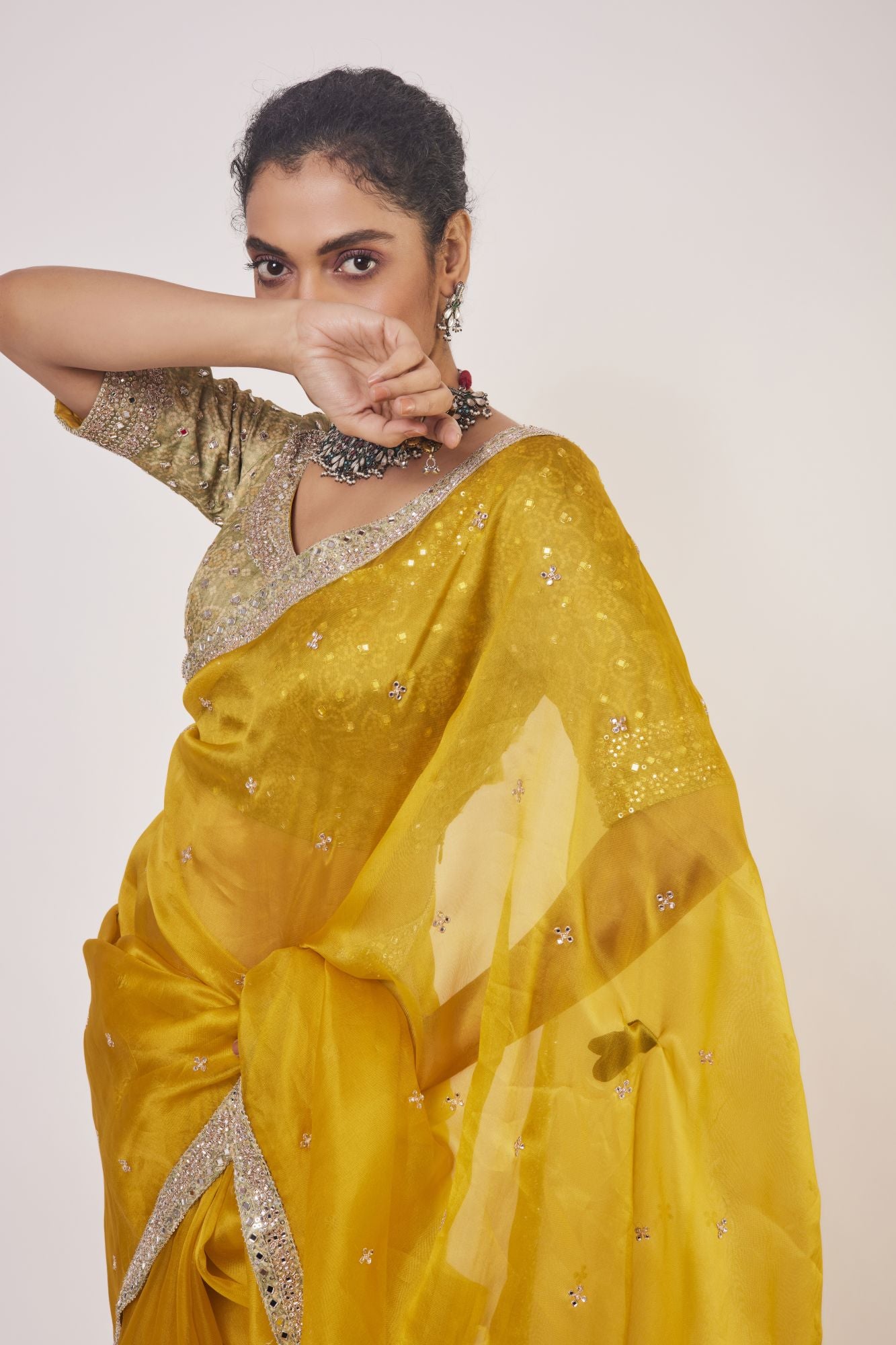 Buy stunning mustard embroidered organza saree online in USA with golden saree blouse. Make a fashion statement on festive occasions and weddings with designer sarees, designer suits, Indian dresses, Anarkali suits, palazzo suits, designer gowns, sharara suits, embroidered sarees from Pure Elegance Indian fashion store in USA.-closeup
