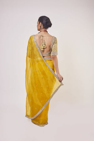 Buy stunning mustard embroidered organza saree online in USA with golden saree blouse. Make a fashion statement on festive occasions and weddings with designer sarees, designer suits, Indian dresses, Anarkali suits, palazzo suits, designer gowns, sharara suits, embroidered sarees from Pure Elegance Indian fashion store in USA.-back