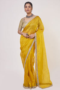 Buy stunning mustard embroidered organza saree online in USA with golden saree blouse. Make a fashion statement on festive occasions and weddings with designer sarees, designer suits, Indian dresses, Anarkali suits, palazzo suits, designer gowns, sharara suits, embroidered sarees from Pure Elegance Indian fashion store in USA.-full view
