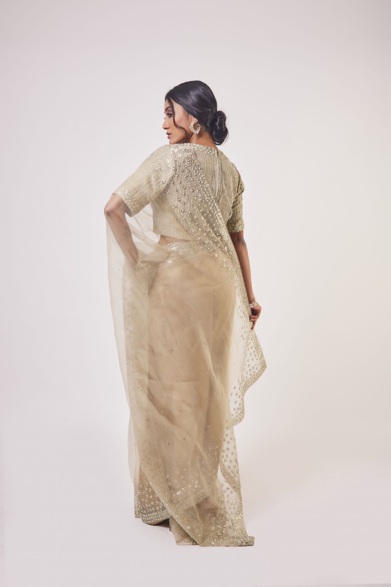 Buy beige embroidered organza saree online in USA with embroidered saree blouse. Make a fashion statement on festive occasions and weddings with designer sarees, designer suits, Indian dresses, Anarkali suits, palazzo suits, designer gowns, sharara suits, embroidered sarees from Pure Elegance Indian fashion store in USA.-back