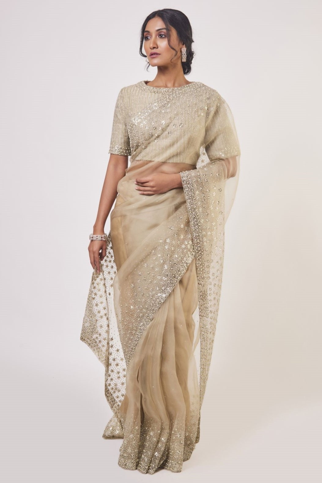 Buy beige embroidered organza saree online in USA with embroidered saree blouse. Make a fashion statement on festive occasions and weddings with designer sarees, designer suits, Indian dresses, Anarkali suits, palazzo suits, designer gowns, sharara suits, embroidered sarees from Pure Elegance Indian fashion store in USA.-full view