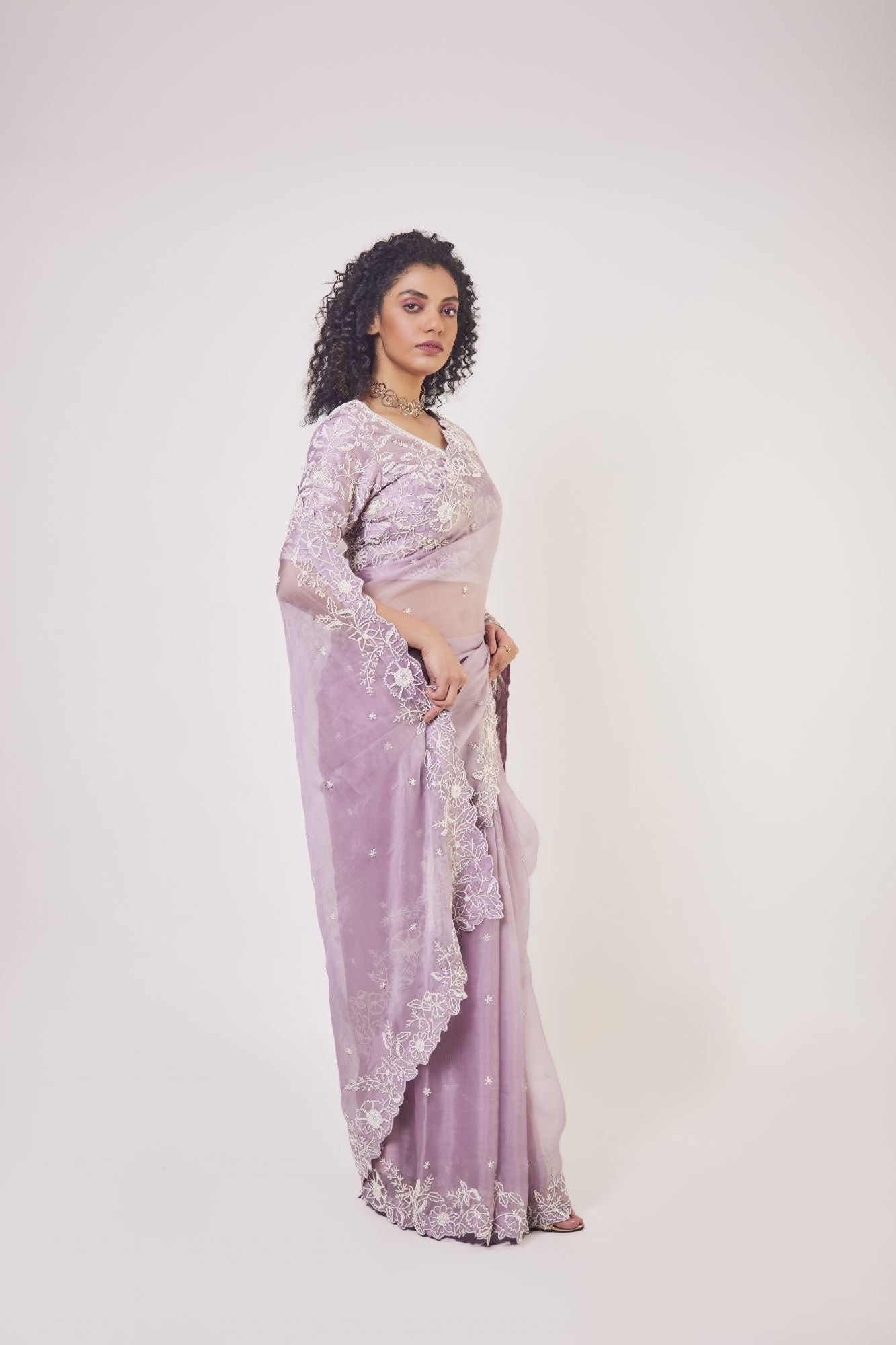 Shop beautiful lilac embroidered organza saree online in USA with designer saree blouse. Make a fashion statement on festive occasions and weddings with designer sarees, designer suits, Indian dresses, Anarkali suits, palazzo suits, designer gowns, sharara suits, embroidered sarees from Pure Elegance Indian fashion store in USA.-side