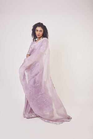 Shop beautiful lilac embroidered organza saree online in USA with designer saree blouse. Make a fashion statement on festive occasions and weddings with designer sarees, designer suits, Indian dresses, Anarkali suits, palazzo suits, designer gowns, sharara suits, embroidered sarees from Pure Elegance Indian fashion store in USA.-pallu