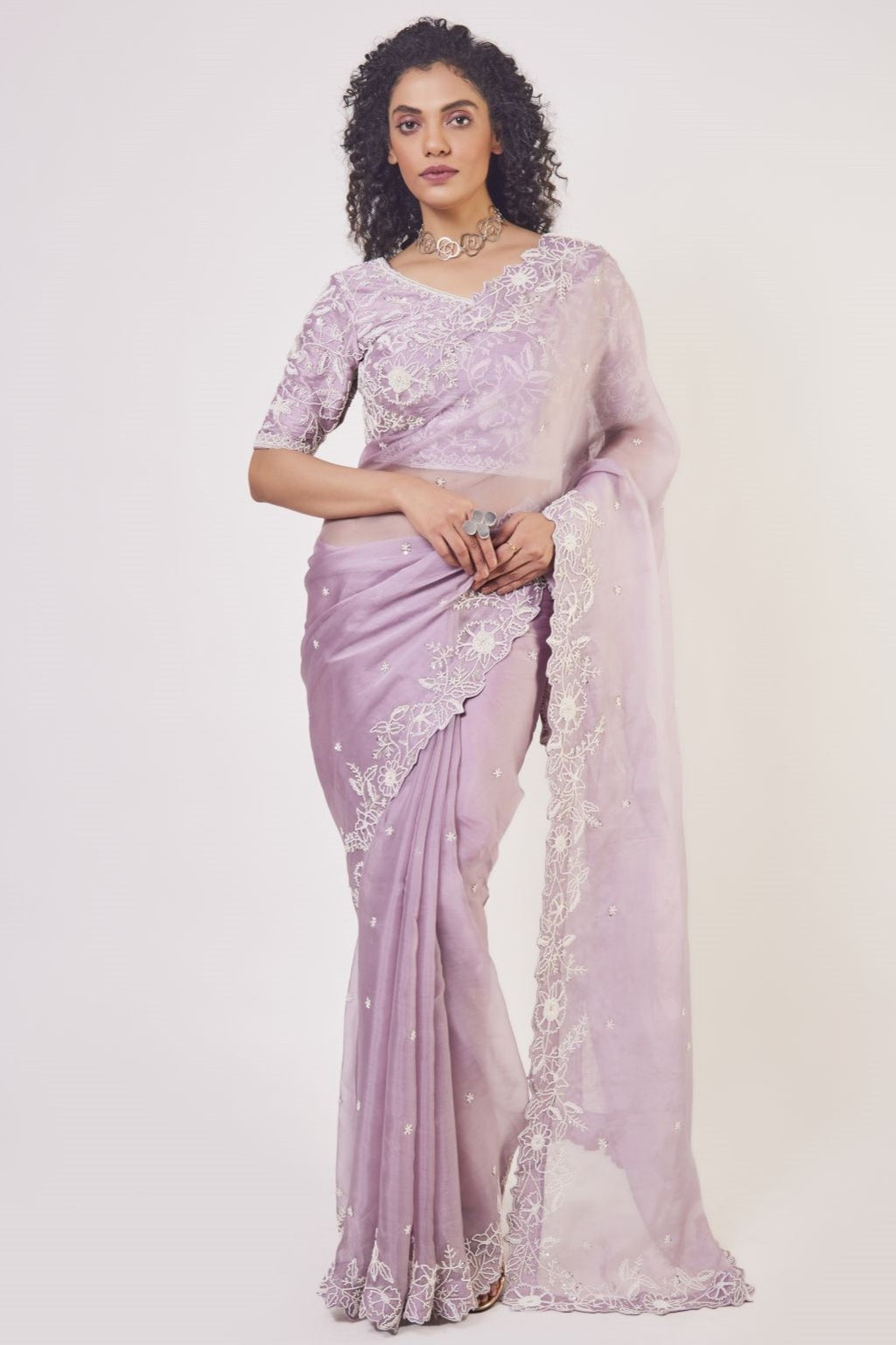 Shop beautiful lilac embroidered organza saree online in USA with designer saree blouse. Make a fashion statement on festive occasions and weddings with designer sarees, designer suits, Indian dresses, Anarkali suits, palazzo suits, designer gowns, sharara suits, embroidered sarees from Pure Elegance Indian fashion store in USA.-full view