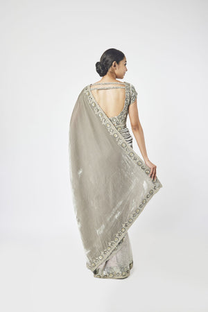 Buy grey embroidered organza and velvet saree online in USA with saree blouse. Make a fashion statement on festive occasions and weddings with designer sarees, designer suits, Indian dresses, Anarkali suits, palazzo suits, designer gowns, sharara suits, embroidered sarees from Pure Elegance Indian fashion store in USA.-back