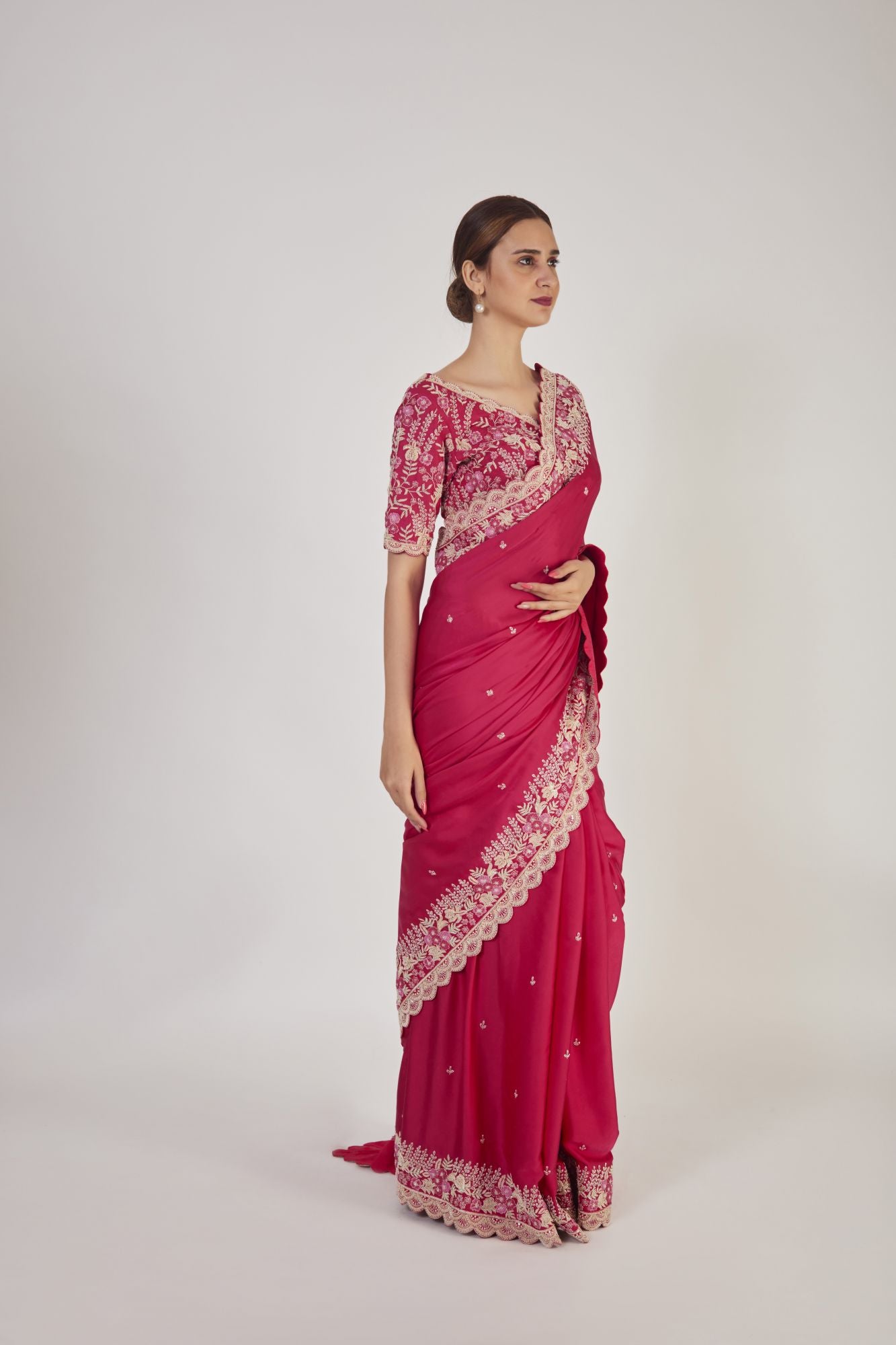 Shop rani pink embroidered raw silk saree online in USA with saree blouse. Make a fashion statement on festive occasions and weddings with designer sarees, designer suits, Indian dresses, Anarkali suits, palazzo suits, designer gowns, sharara suits, embroidered sarees from Pure Elegance Indian fashion store in USA.-right