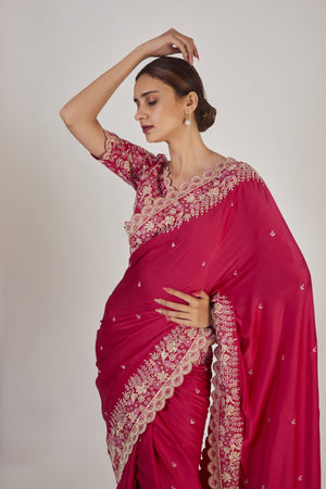 Shop rani pink embroidered raw silk saree online in USA with saree blouse. Make a fashion statement on festive occasions and weddings with designer sarees, designer suits, Indian dresses, Anarkali suits, palazzo suits, designer gowns, sharara suits, embroidered sarees from Pure Elegance Indian fashion store in USA.-closeup