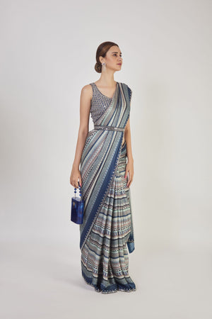Buy blue cutdana and mirror work handloom saree online in USA with saree blouse. Make a fashion statement on festive occasions and weddings with designer sarees, designer suits, Indian dresses, Anarkali suits, palazzo suits, designer gowns, sharara suits, embroidered sarees from Pure Elegance Indian fashion store in USA.-right