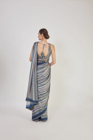 Buy blue cutdana and mirror work handloom saree online in USA with saree blouse. Make a fashion statement on festive occasions and weddings with designer sarees, designer suits, Indian dresses, Anarkali suits, palazzo suits, designer gowns, sharara suits, embroidered sarees from Pure Elegance Indian fashion store in USA.-back