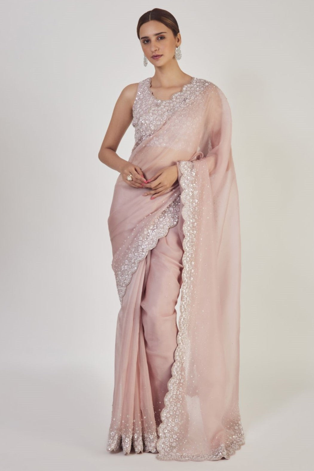 Buy dusty peach embroidered organza saree online in USA with saree blouse. Make a fashion statement on festive occasions and weddings with designer sarees, designer suits, Indian dresses, Anarkali suits, palazzo suits, designer gowns, sharara suits, embroidered sarees from Pure Elegance Indian fashion store in USA.-full view