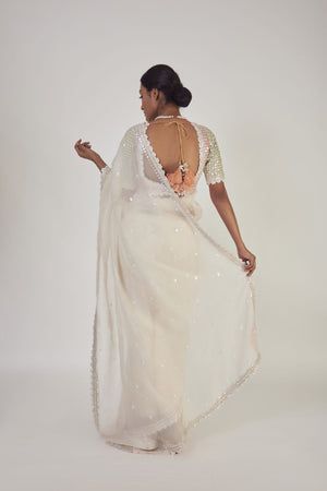 Shop cream embroidered organza saree online in USA with saree blouse. Make a fashion statement on festive occasions and weddings with designer sarees, designer suits, Indian dresses, Anarkali suits, palazzo suits, designer gowns, sharara suits, embroidered sarees from Pure Elegance Indian fashion store in USA.-back