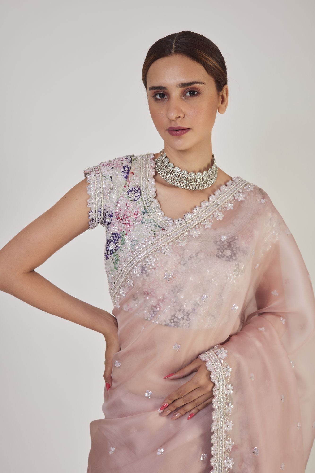 Shop cream embroidered organza saree online in USA with saree blouse. Make a fashion statement on festive occasions and weddings with designer sarees, designer suits, Indian dresses, Anarkali suits, palazzo suits, designer gowns, sharara suits, embroidered sarees from Pure Elegance Indian fashion store in USA.-closeup