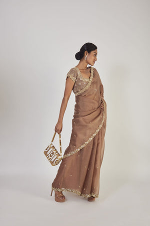 Buy beautiful light coffee brown sequin work organza saree online in USA with saree blouse. Make a fashion statement on festive occasions and weddings with designer sarees, designer suits, Indian dresses, Anarkali suits, palazzo suits, designer gowns, sharara suits, embroidered sarees from Pure Elegance Indian fashion store in USA.-side