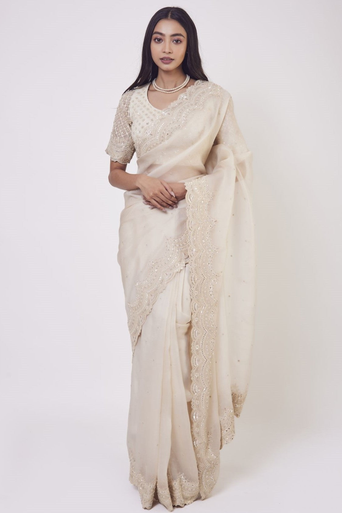 Shop beautiful cream embroidered organza saree online in USA with saree blouse. Make a fashion statement on festive occasions and weddings with designer sarees, designer suits, Indian dresses, Anarkali suits, palazzo suits, designer gowns, sharara suits, embroidered sarees from Pure Elegance Indian fashion store in USA.-full view