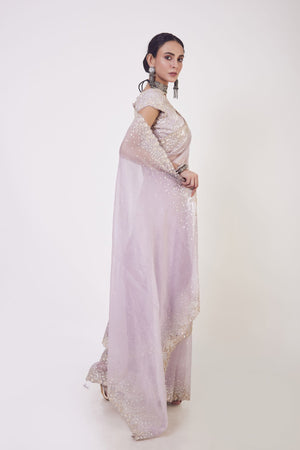 Buy beautiful onion pink embroidered organza saree online in USA with saree blouse. Make a fashion statement on festive occasions and weddings with designer sarees, designer suits, Indian dresses, Anarkali suits, palazzo suits, designer gowns, sharara suits, embroidered sarees from Pure Elegance Indian fashion store in USA.-right