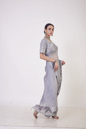 Buy stunning grey embroidered organza saree online in USA with saree blouse. Make a fashion statement on festive occasions and weddings with designer sarees, designer suits, Indian dresses, Anarkali suits, palazzo suits, designer gowns, sharara suits, embroidered sarees from Pure Elegance Indian fashion store in USA.-right