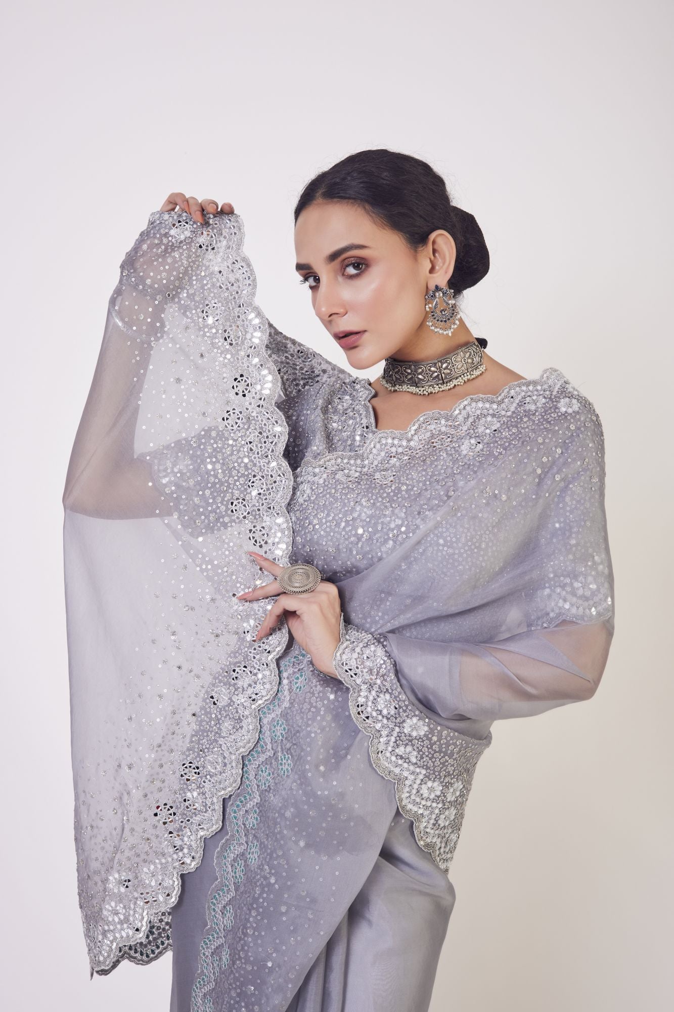 Buy stunning grey embroidered organza saree online in USA with saree blouse. Make a fashion statement on festive occasions and weddings with designer sarees, designer suits, Indian dresses, Anarkali suits, palazzo suits, designer gowns, sharara suits, embroidered sarees from Pure Elegance Indian fashion store in USA.-closeup