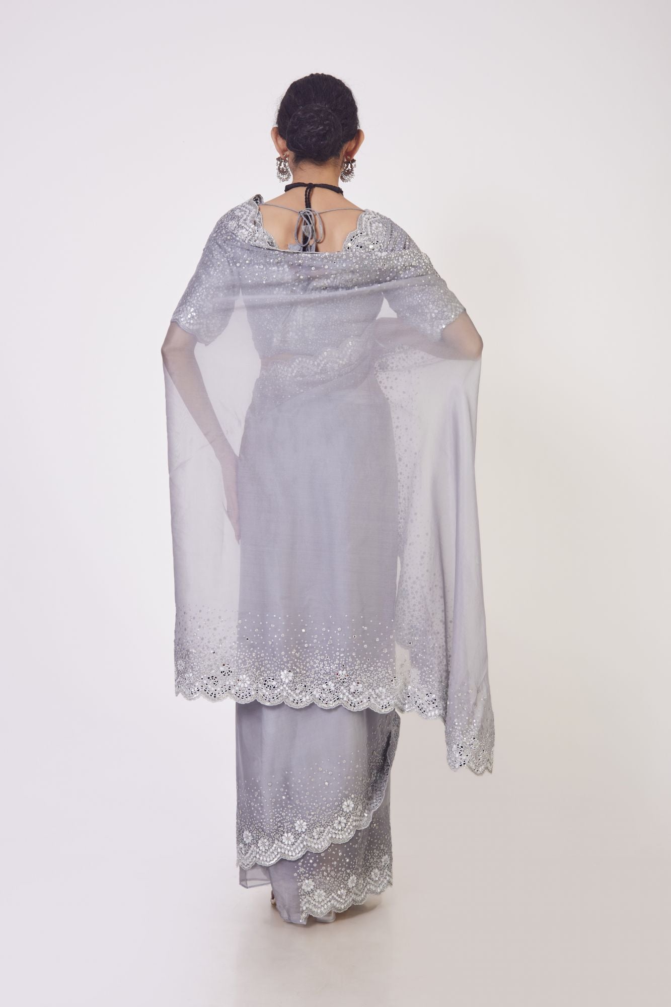 Buy stunning grey embroidered organza saree online in USA with saree blouse. Make a fashion statement on festive occasions and weddings with designer sarees, designer suits, Indian dresses, Anarkali suits, palazzo suits, designer gowns, sharara suits, embroidered sarees from Pure Elegance Indian fashion store in USA.-back
