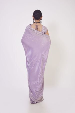 Buy beautiful lilac sequin and mirror work crepe saree online in USA. Make a fashion statement on festive occasions and weddings with designer sarees, designer suits, Indian dresses, Anarkali suits, palazzo suits, designer gowns, sharara suits, embroidered sarees from Pure Elegance Indian fashion store in USA.-back