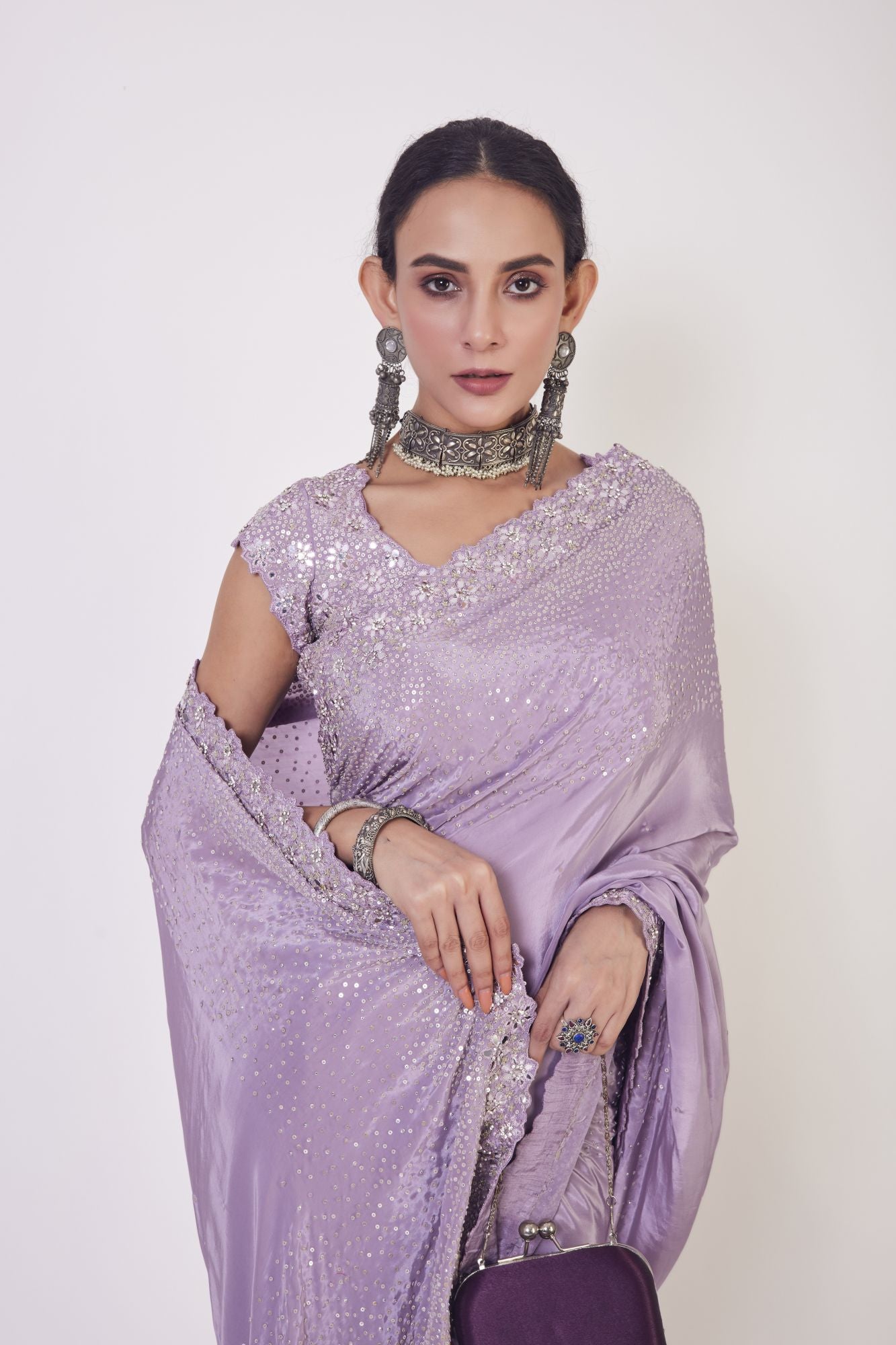 Buy beautiful lilac sequin and mirror work crepe saree online in USA. Make a fashion statement on festive occasions and weddings with designer sarees, designer suits, Indian dresses, Anarkali suits, palazzo suits, designer gowns, sharara suits, embroidered sarees from Pure Elegance Indian fashion store in USA.-closeup