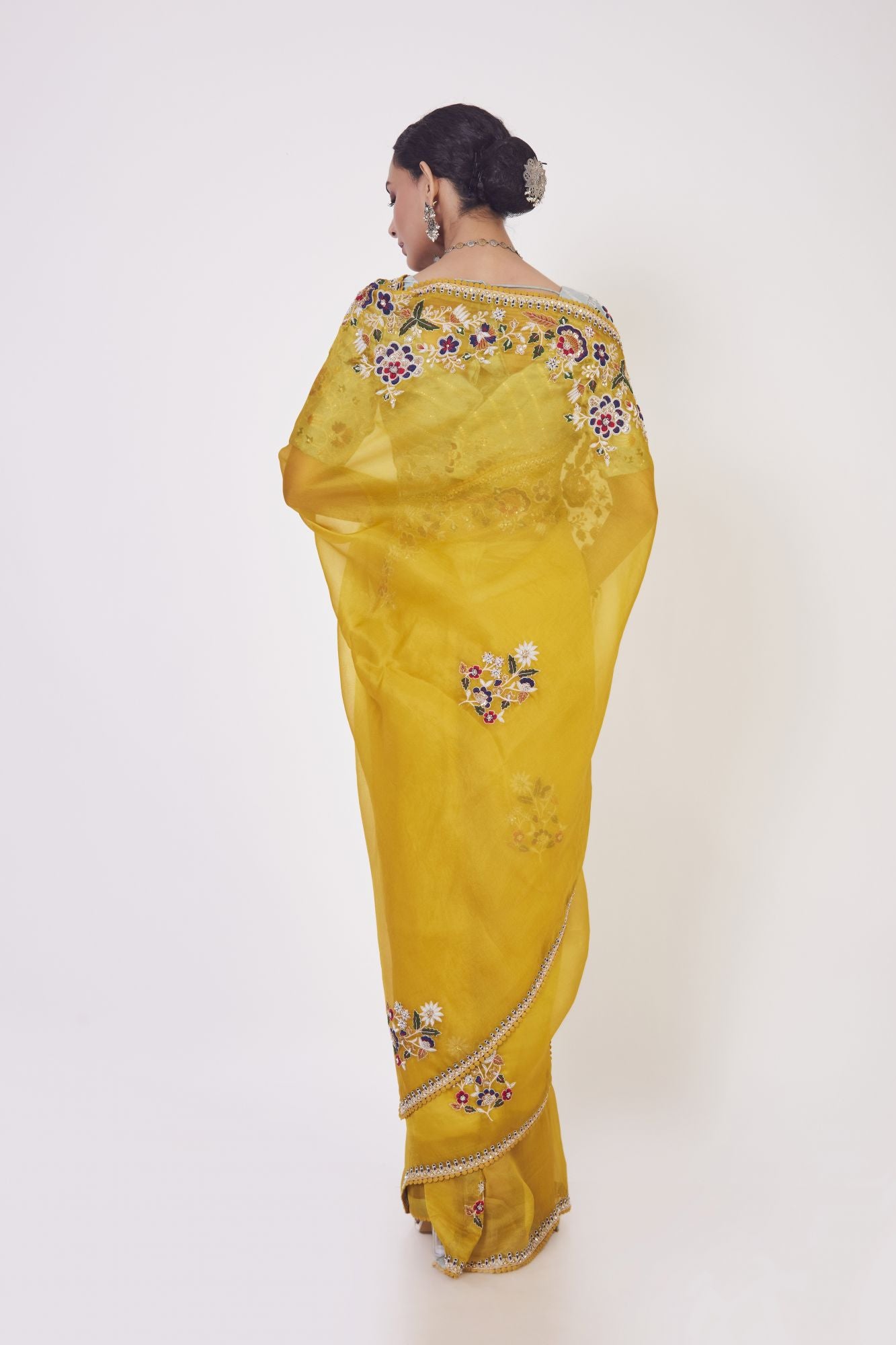 Shop mustard embroidered organza sari online in USA with grey blouse. Make a fashion statement on festive occasions and weddings with designer sarees, designer suits, Indian dresses, Anarkali suits, palazzo suits, designer gowns, sharara suits, embroidered sarees from Pure Elegance Indian fashion store in USA.-back