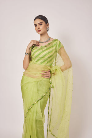Buy pista green cutdana and pearl work organza sari online in USA. Make a fashion statement on festive occasions and weddings with designer sarees, designer suits, Indian dresses, Anarkali suits, palazzo suits, designer gowns, sharara suits, embroidered sarees from Pure Elegance Indian fashion store in USA.-closeup