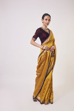 Shop mustard tikki work handloom sari online in USA with wine color blouse. Make a fashion statement on festive occasions and weddings with designer sarees, designer suits, Indian dresses, Anarkali suits, palazzo suits, designer gowns, sharara suits, embroidered sarees from Pure Elegance Indian fashion store in USA.-side