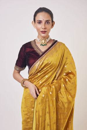 Shop mustard tikki work handloom sari online in USA with wine color blouse. Make a fashion statement on festive occasions and weddings with designer sarees, designer suits, Indian dresses, Anarkali suits, palazzo suits, designer gowns, sharara suits, embroidered sarees from Pure Elegance Indian fashion store in USA.-closeup