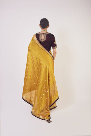 Shop mustard tikki work handloom sari online in USA with wine color blouse. Make a fashion statement on festive occasions and weddings with designer sarees, designer suits, Indian dresses, Anarkali suits, palazzo suits, designer gowns, sharara suits, embroidered sarees from Pure Elegance Indian fashion store in USA.-back