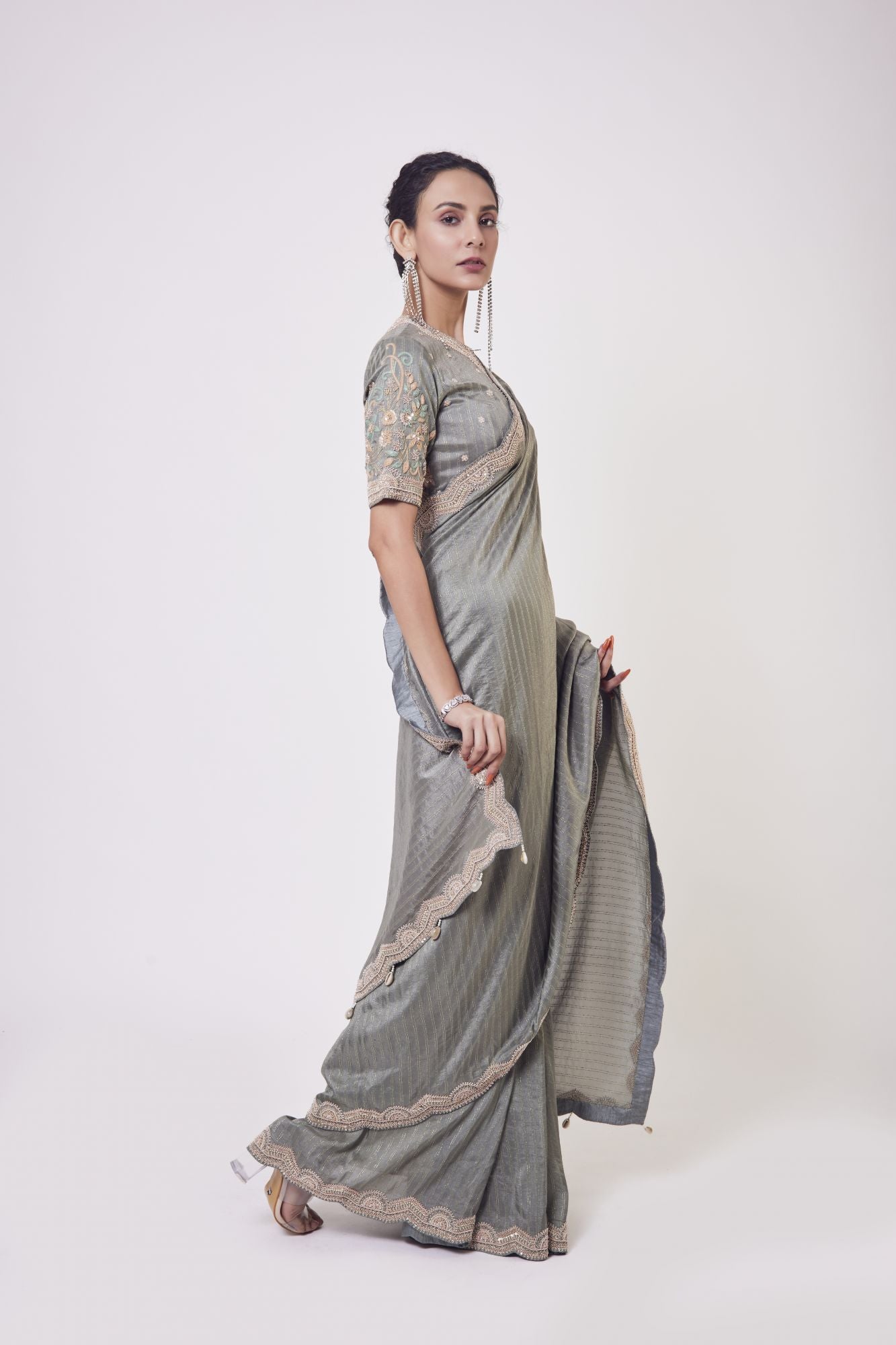 Buy grey zardozi embroidery Russian fabric sari online in USA with blouse. Make a fashion statement on festive occasions and weddings with designer sarees, designer suits, Indian dresses, Anarkali suits, palazzo suits, designer gowns, sharara suits, embroidered sarees from Pure Elegance Indian fashion store in USA.-right