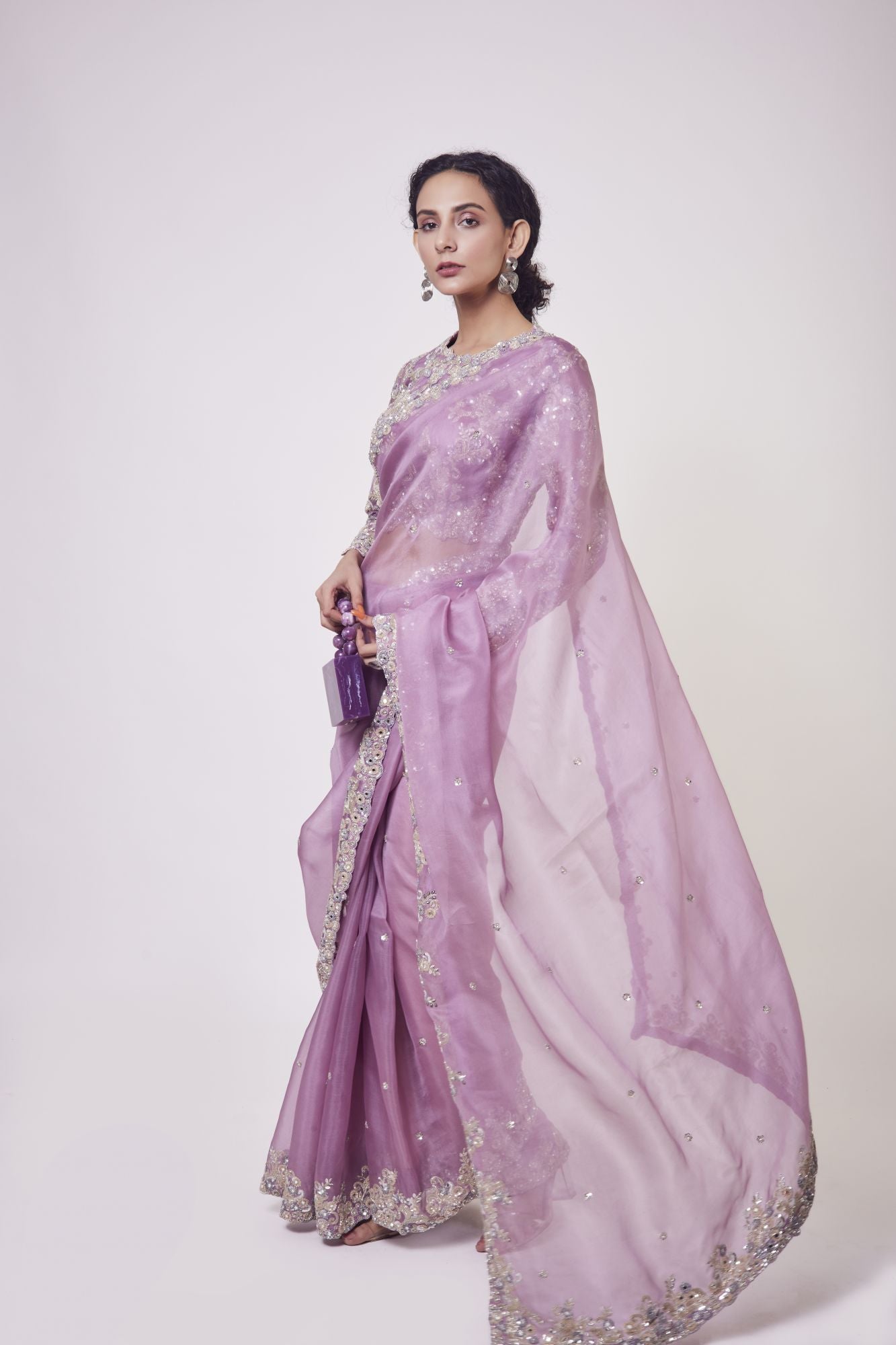 Buy lavender mirror work organza sari online in USA with blouse. Make a fashion statement on festive occasions and weddings with designer sarees, designer suits, Indian dresses, Anarkali suits, palazzo suits, designer gowns, sharara suits, embroidered sarees from Pure Elegance Indian fashion store in USA.-pallu
