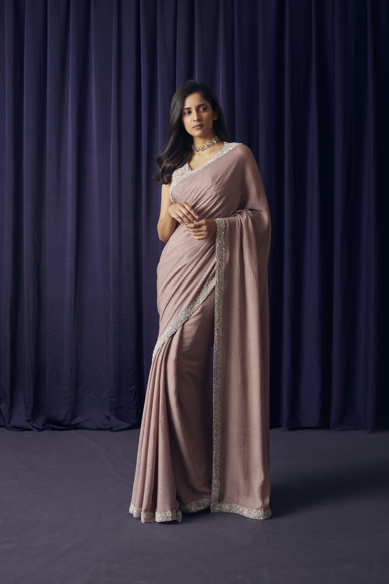 Buy beautiful onion pink embroidered silk sari online in USA with blouse. Make a fashion statement on festive occasions and weddings with designer sarees, designer suits, Indian dresses, Anarkali suits, palazzo suits, designer gowns, sharara suits, embroidered sarees from Pure Elegance Indian fashion store in USA.-front