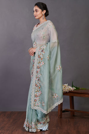 Buy sea green embroidered organza sari online in USA with blouse. Make a fashion statement on festive occasions and weddings with designer sarees, designer suits, Indian dresses, Anarkali suits, palazzo suits, designer gowns, sharara suits, embroidered sarees from Pure Elegance Indian fashion store in USA.-pallu