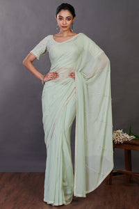 Shop mint green embroidered georgette sari online in USA with blouse. Make a fashion statement on festive occasions and weddings with designer sarees, designer suits, Indian dresses, Anarkali suits, palazzo suits, designer gowns, sharara suits, embroidered sarees from Pure Elegance Indian fashion store in USA.-full view