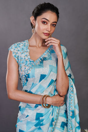 Buy aqua blue printed satin sequin work sari online in USA with blouse. Make a fashion statement on festive occasions and weddings with designer sarees, designer suits, Indian dresses, Anarkali suits, palazzo suits, designer gowns, sharara suits, embroidered sarees from Pure Elegance Indian fashion store in USA.-closeup